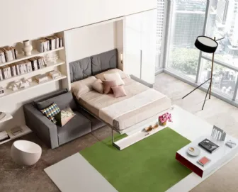 Sistema trasformabile Ambiente 03 divano Swing vista aperto con Living Young System componibile di Clei